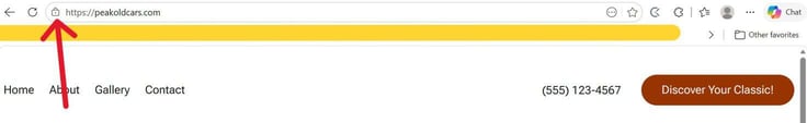 Chrome browser address bar showing https://peakoldcars.com with a lock icon confirming a secure HTTPS connection, with a red annotation arrow pointing up to the address bar, and the top of the peakoldcars.com website visible below showing a yellow header banner and navigation links for Home, About, Gallery, and Contact alongside a phone number and an orange Discover Your Classic button. Chrome browser address bar showing https://peakoldcars.com with a lock icon confirming a secure HTTPS connection, with a red annotation arrow pointing up to the address bar, and the top of the peakoldcars.com website visible below showing a yellow header banner and navigation links for Home, About, Gallery, and Contact alongside a phone number and an orange Discover Your Classic button.