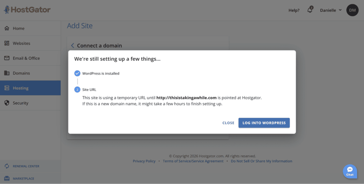 HostGator hosting dashboard setup confirmation window showing WordPress installed successfully and a domain connection still pending, with a temporary site URL displayed. HostGator hosting dashboard setup confirmation window showing WordPress installed successfully and a domain connection still pending, with a temporary site URL displayed.