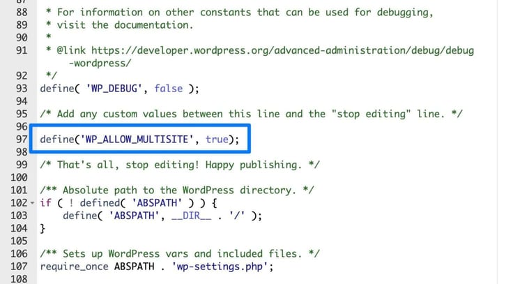 A close-up of the wp-config.php file in a code editor highlights line 97, boxed in blue, containing the single-site network activation code define('WP_ALLOW_MULTISITE', true);, positioned between the WP_DEBUG constant above and the A close-up of the wp-config.php file in a code editor highlights line 97, boxed in blue, containing the single-site network activation code define('WP_ALLOW_MULTISITE', true);, positioned between the WP_DEBUG constant above and the