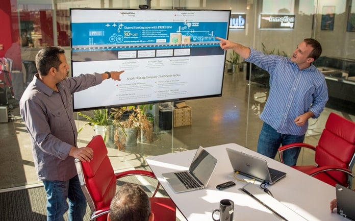 InMotion Hosting's Sunil Saxena leads a team meeting