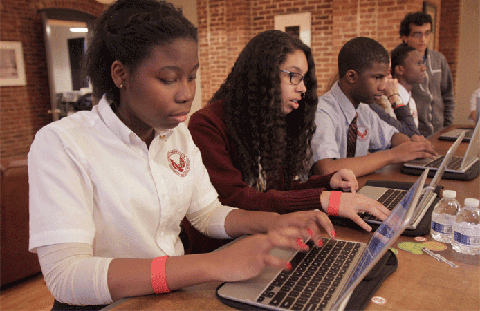 Photo of children practicing programming through Codecademy Photo of children practicing programming through Codecademy