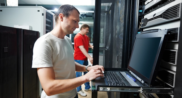Image of technical support staff working in a datacenter Image of technical support staff working in a datacenter