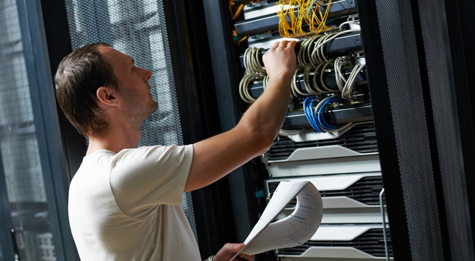 Image of engineer working on a server Image of engineer working on a server