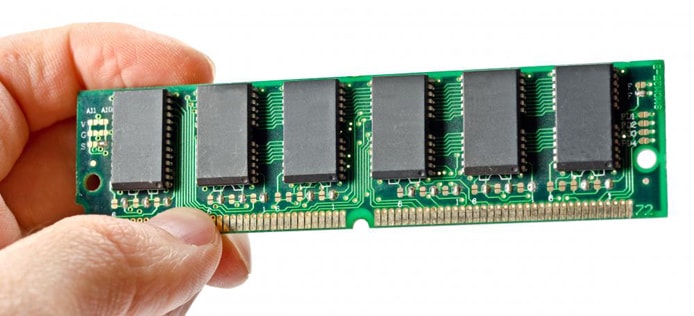 Picture of a hand holding a memory chip Picture of a hand holding a memory chip