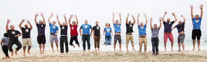 Image of Pagely team jumping on the beach Image of Pagely team jumping on the beach