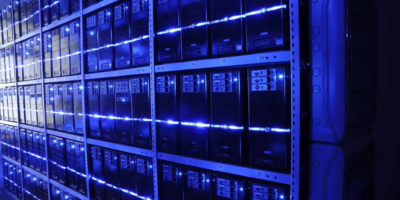Image of a row of servers in a datacenter Image of a row of servers in a datacenter